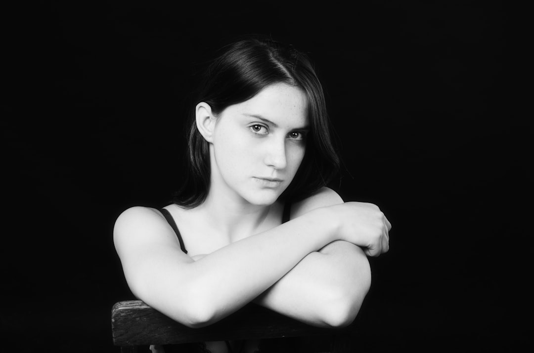 Studio portrait — minimal background, direct expression