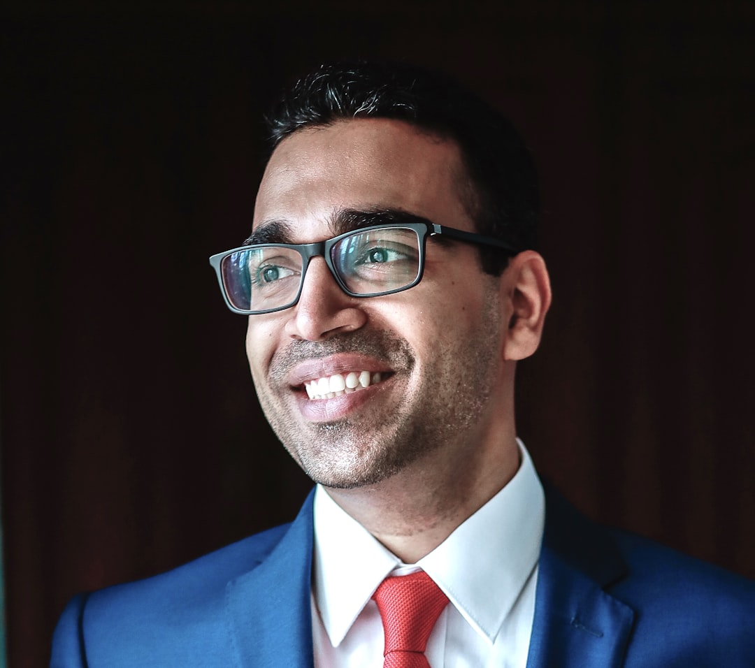 Professional headshot — clean background, confident expression