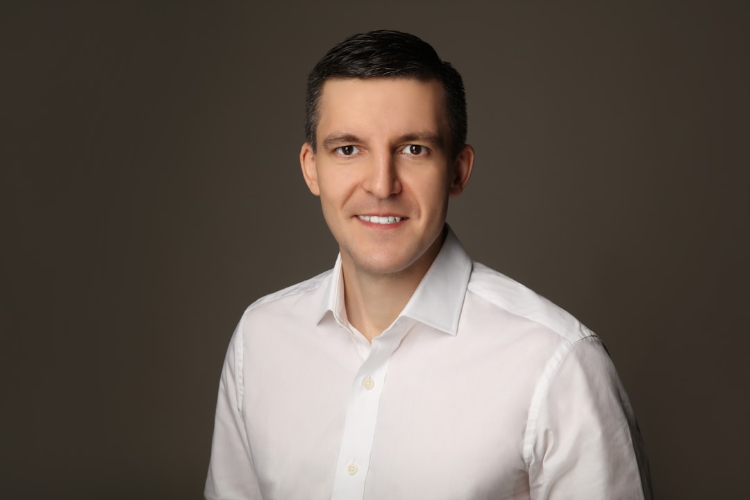 Professional headshot — clean background, confident natural expression